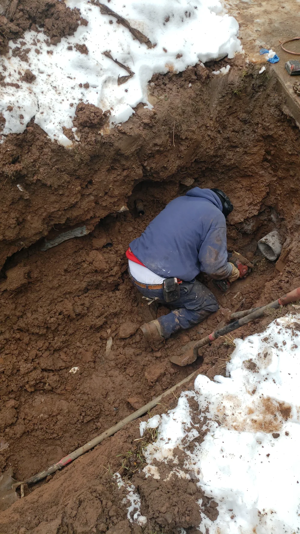 Lofton's DNA Plumbing technician performing underground sewer pipe excavation and foundation tie-in repair in Atlanta Georgia Lofton's DNA Plumbing technician performing underground sewer pipe excavation and foundation tie-in repair in Atlanta Georgia