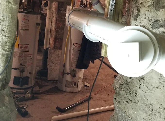 Commercial dual gas water heater tanks with overhead Charlotte PVC main drain cleanout line installation Roswell GA Commercial dual gas water heater tanks with overhead Charlotte PVC main drain cleanout line installation Roswell GA