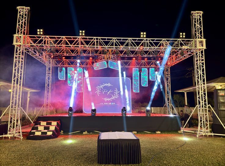 Concert stage lighting truss rig and LED screen setup