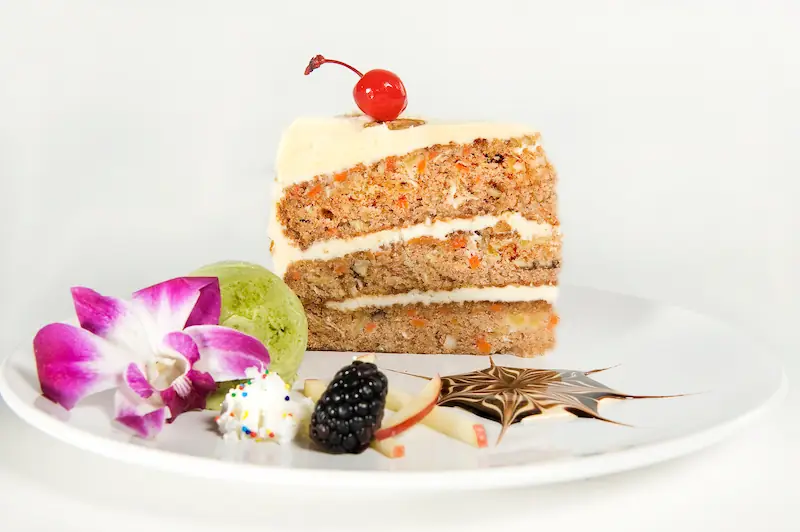 Layered carrot cake with cream cheese frosting and green tea ice cream at Asian Bistro