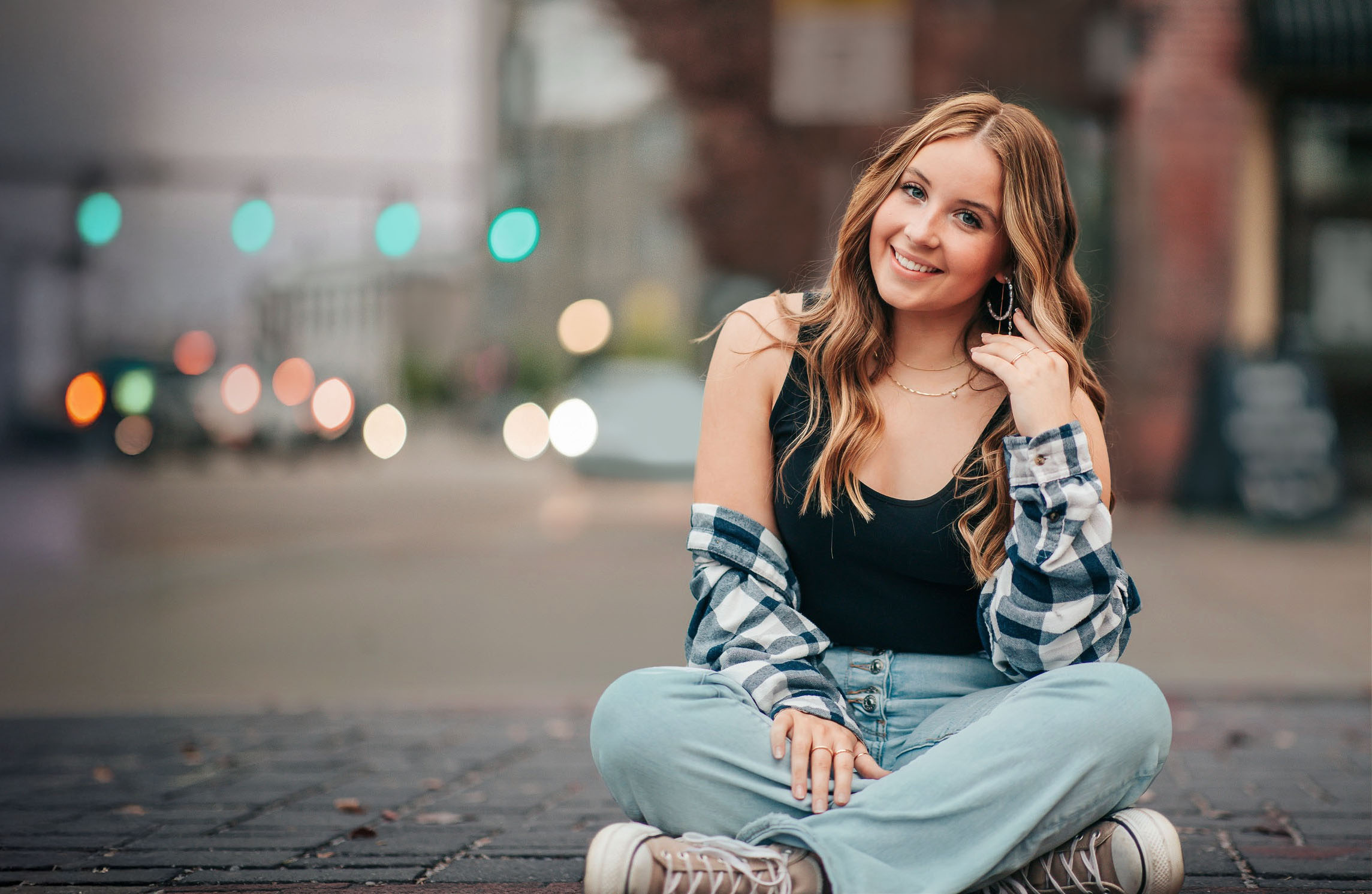 Senior sitting relaxed on city sidewalk