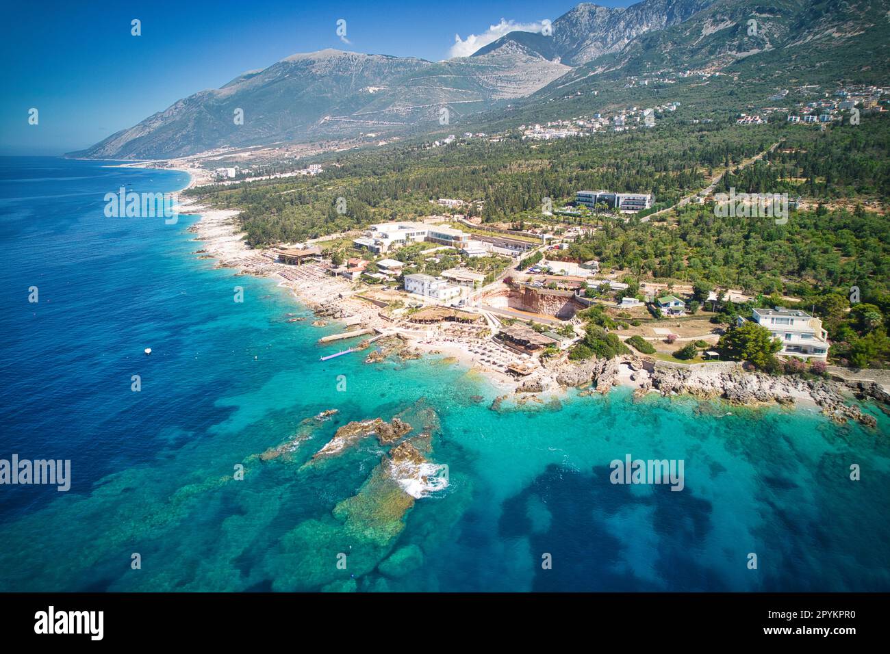 Dhërmi Beach Albanian Riviera crystal blue Ionian waters aerial view