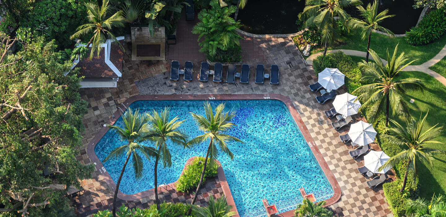 Centara Grand Ladprao Bangkok city resort swimming pool and gardens — photo 1