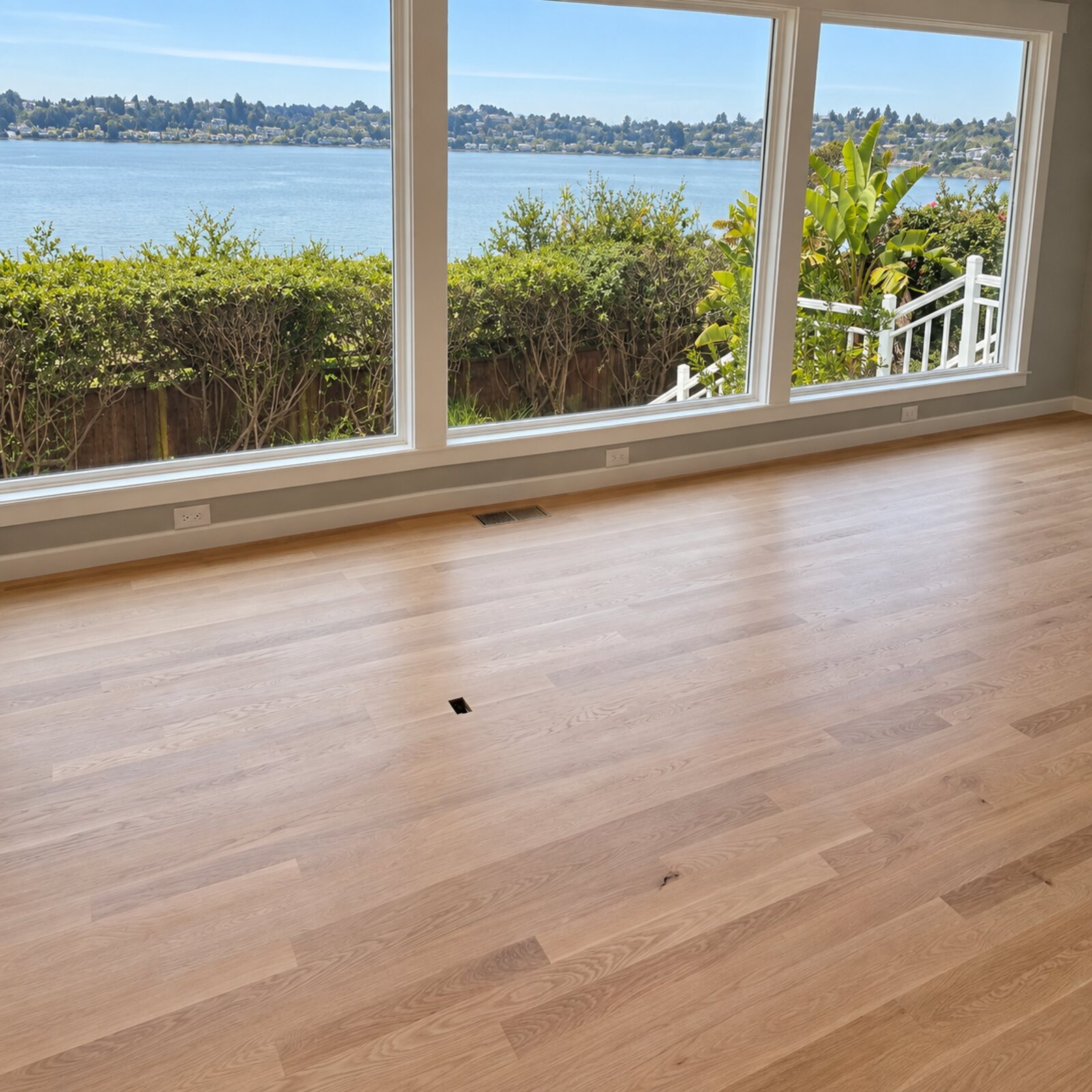 Light oak flooring in a room facing the water