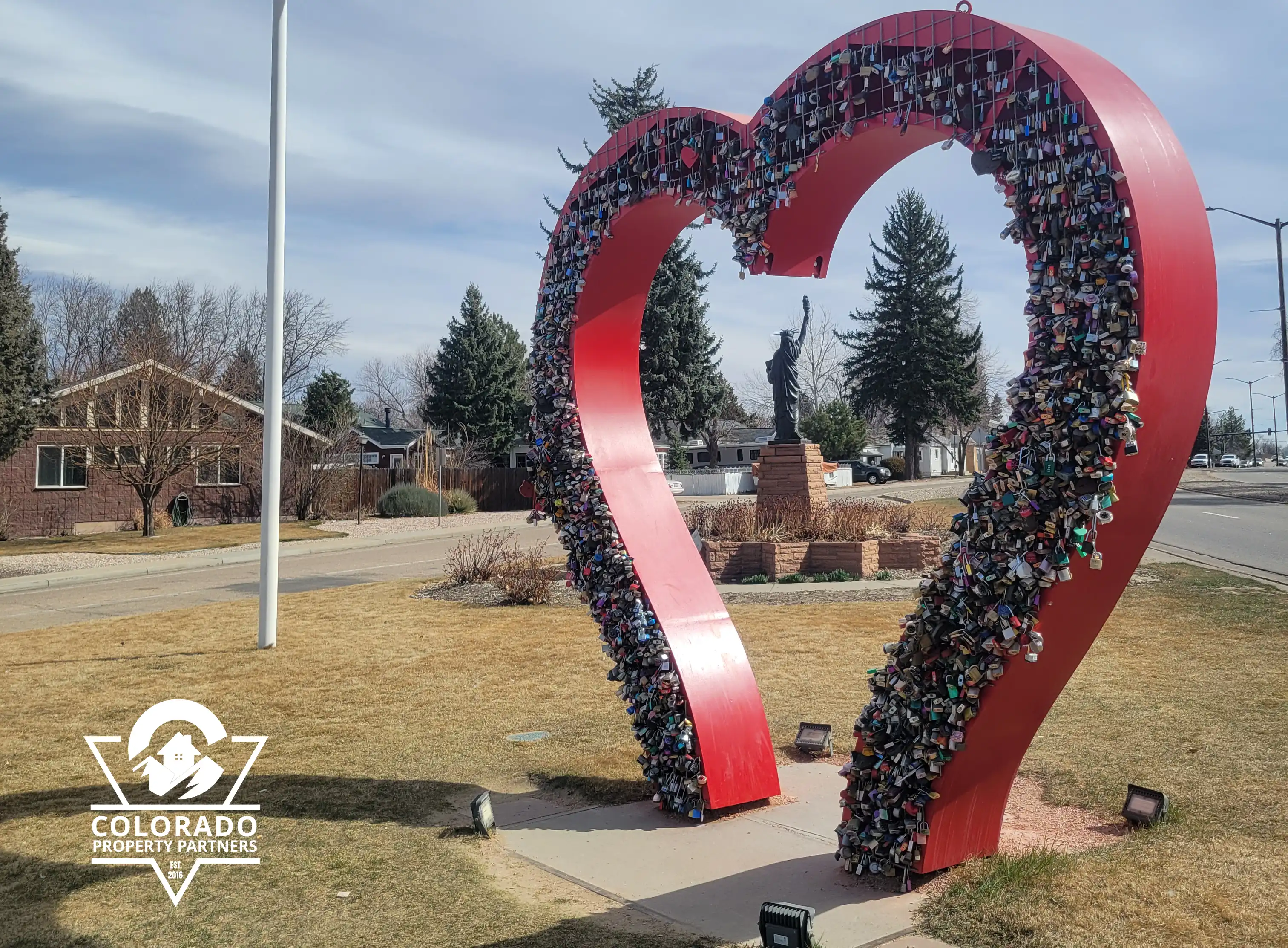 Loveland Love Lock sculpture with Colorado Property Partners