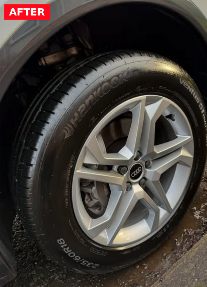Clean, polished alloy wheel and dressed tire after mobile detail