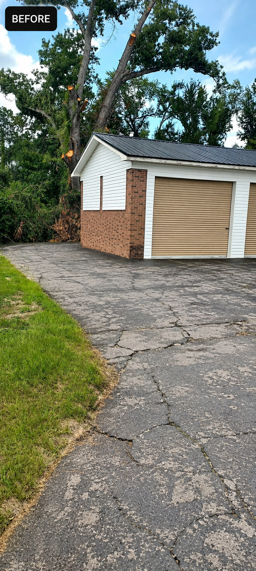 Cracked residential driveway before sealcoating by Coastal Plains