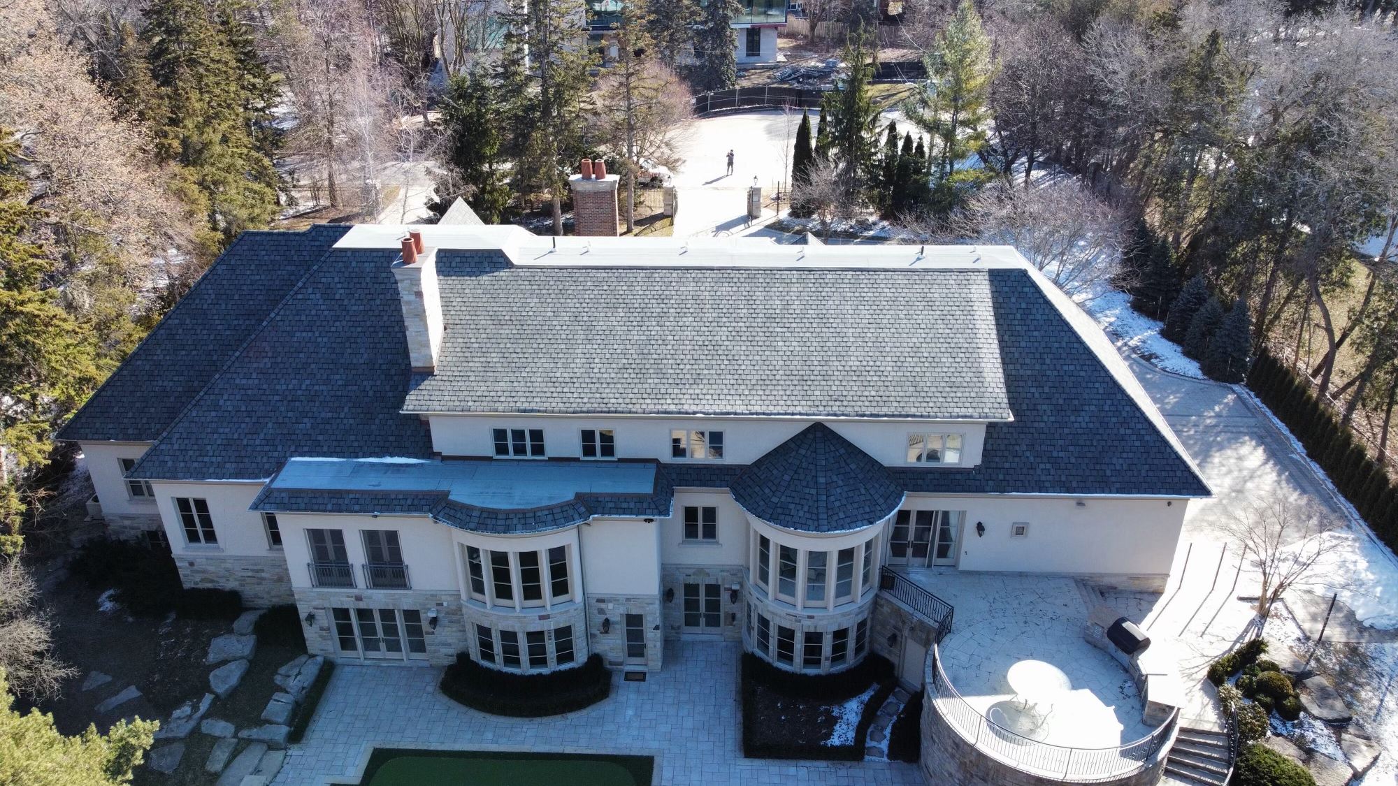 Aerial view of luxury estate with premium custom roofing installed by Eagle Roofing in Toronto