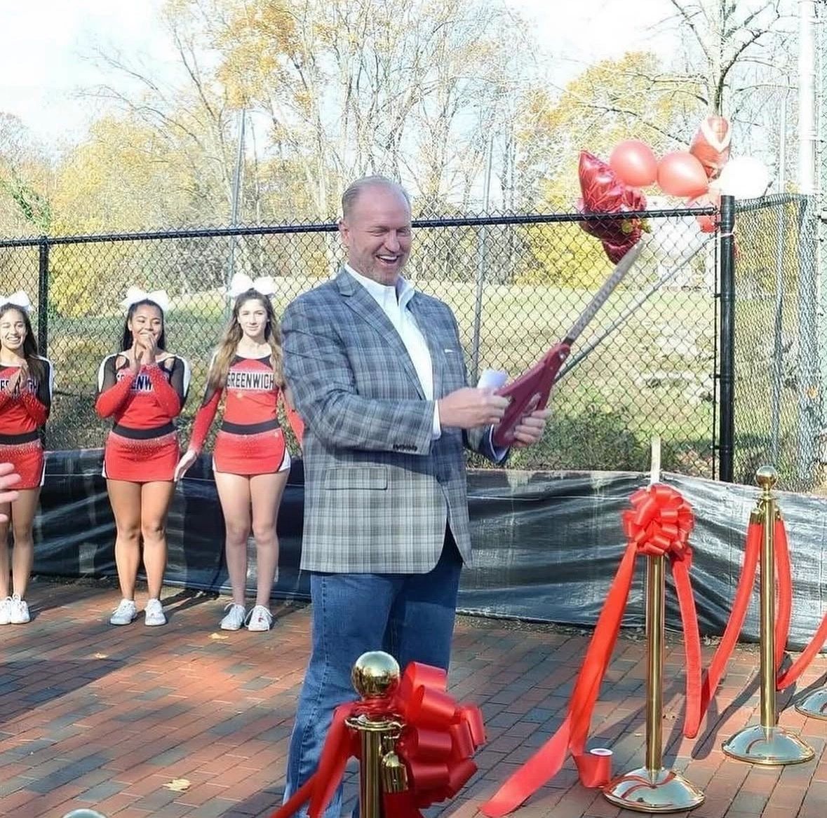 Joe Kelly at a Greenwich ribbon cutting