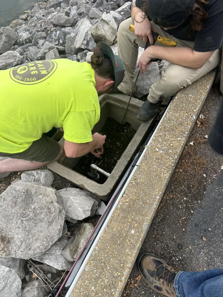 Drain Care LLC technicians servicing a storm drain near Corinth, Mississippi