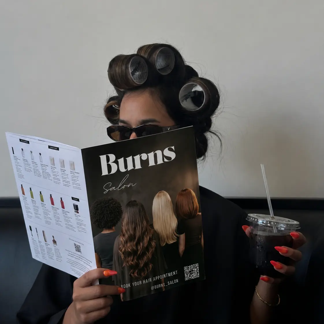 Burns Salon Client looking at hair magazine