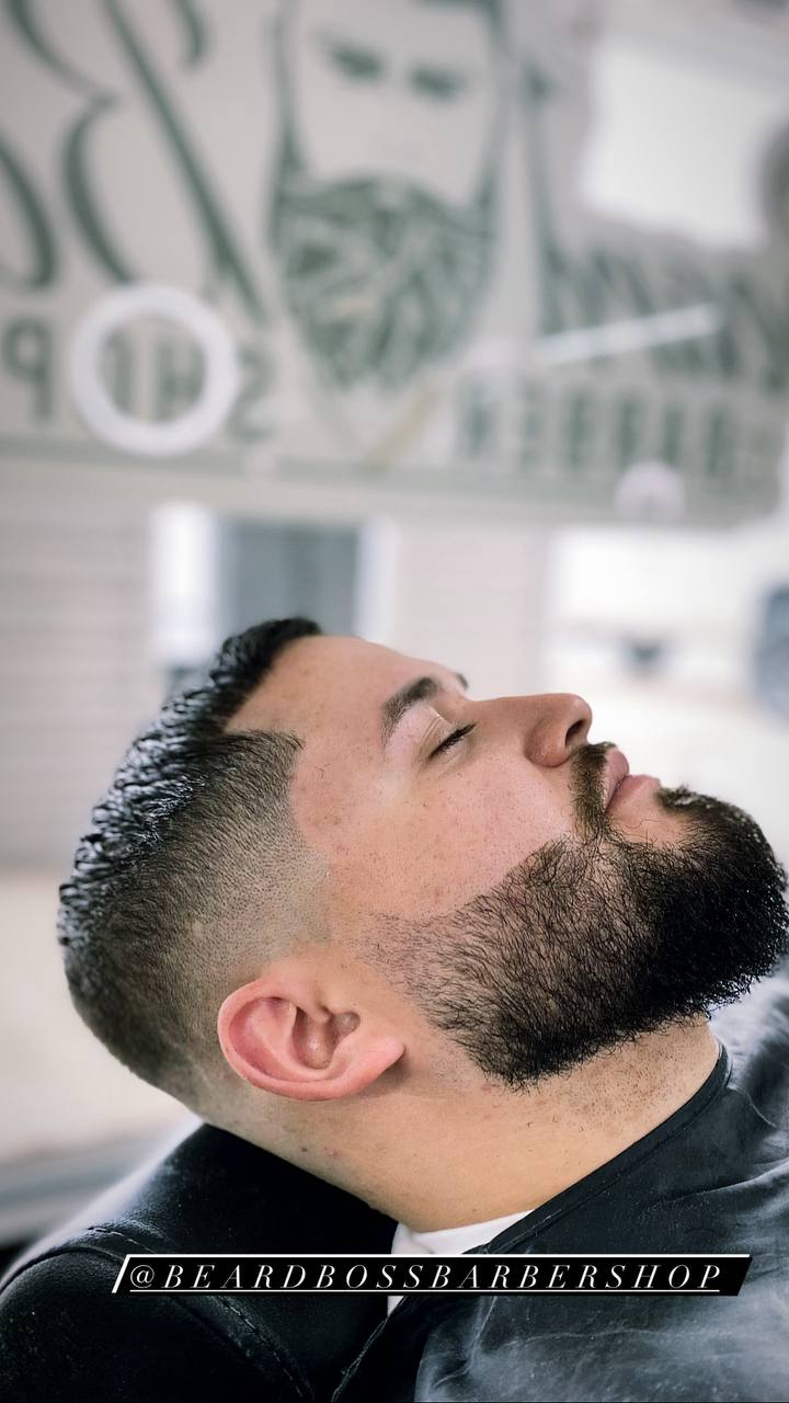 Beard Boss Barbershop — client relaxing during a haircut