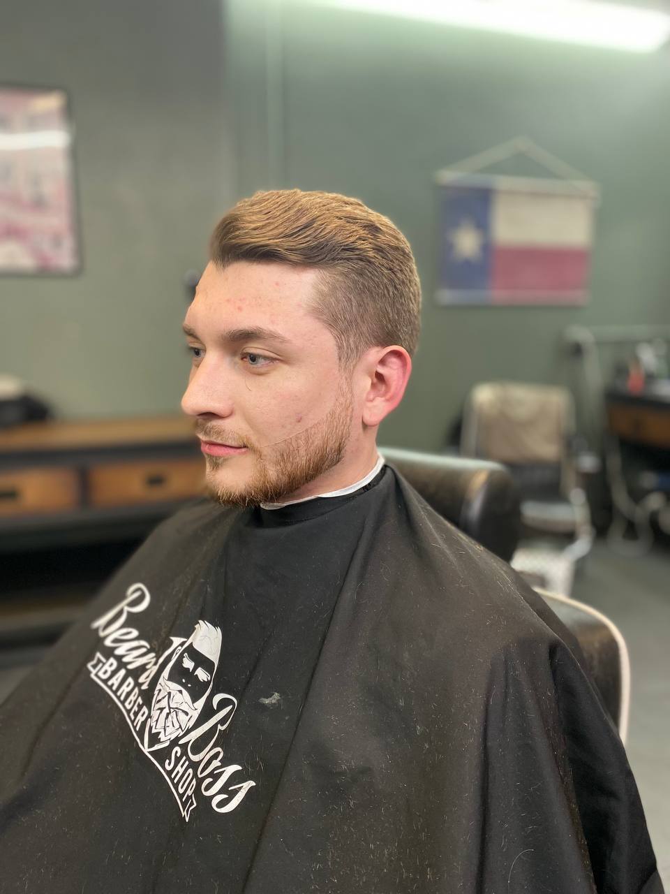 Beard Boss Barbershop — clean side part haircut