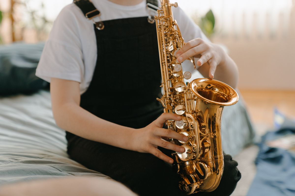 Young musicians collaborating on songwriting in creative studio