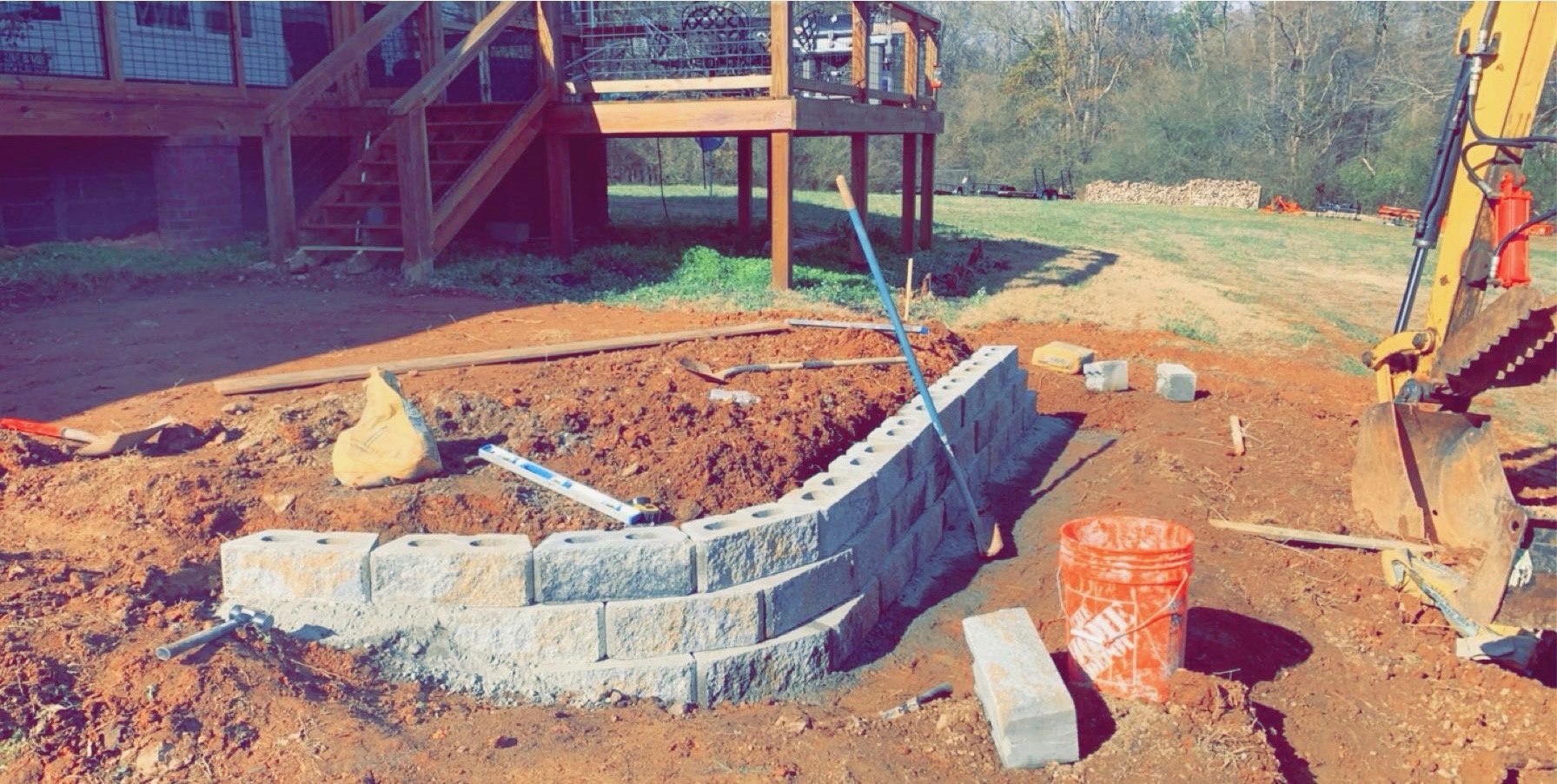 Retaining wall block wall assembly and excavation by Limitless Construction Services