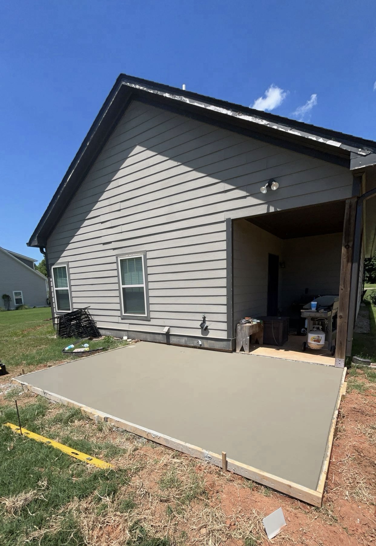 Finished concrete patio slab installation by Limitless Construction Services