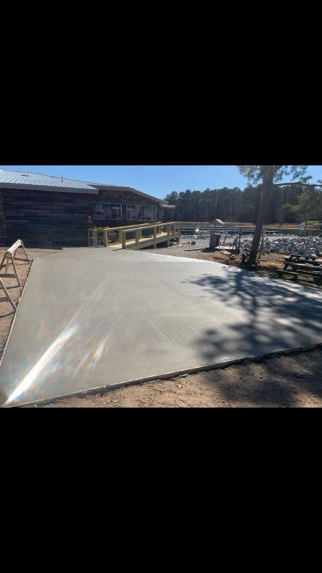 Completed concrete pad installation with clean finished surface by Limitless Construction Services