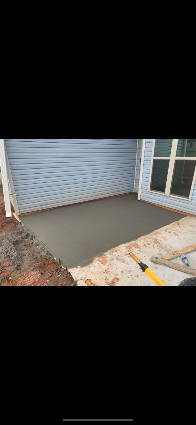 Concrete patio installation detailed finished surface view by Limitless Construction Services
