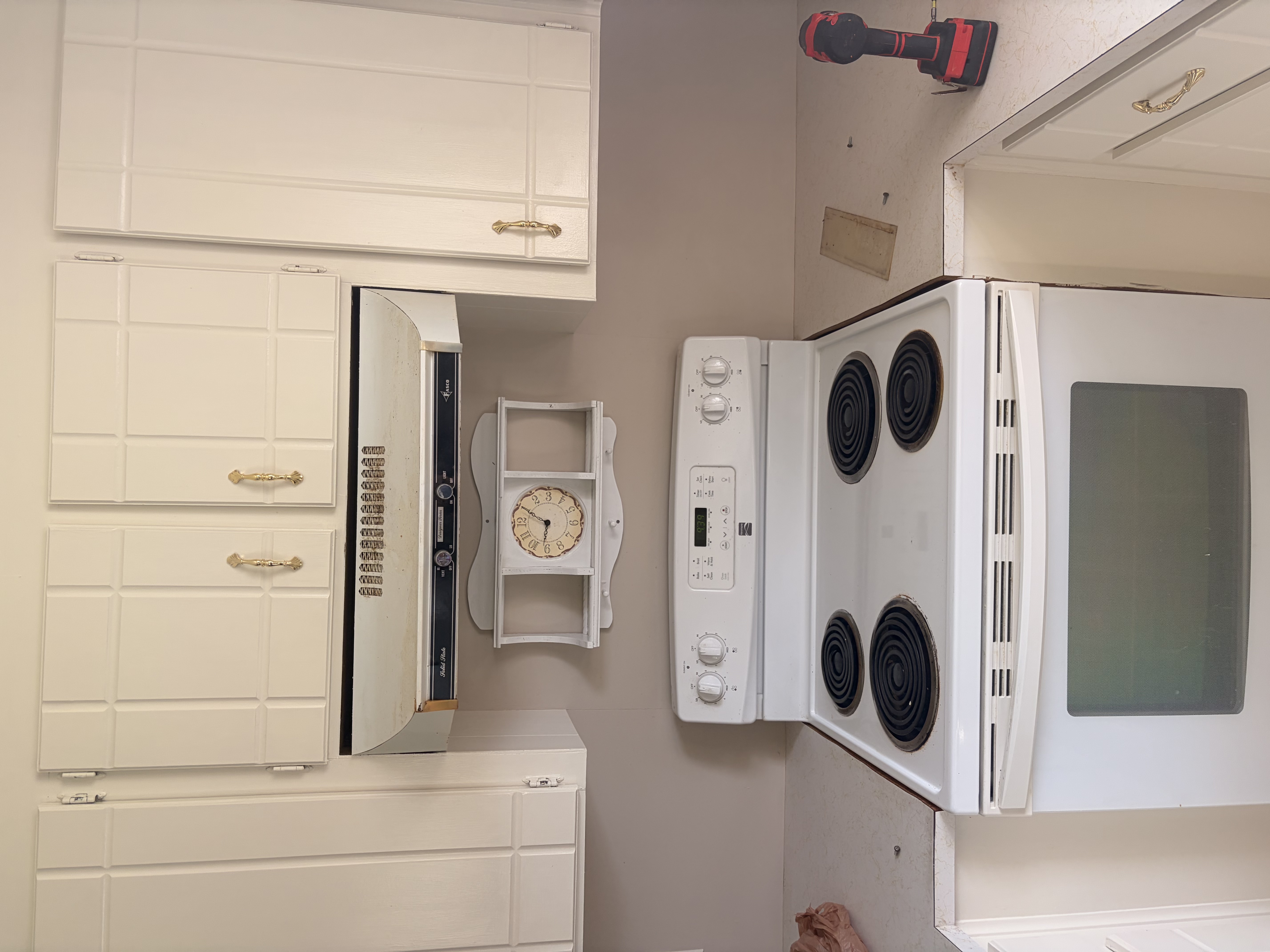 Kitchen range hood area prior to upgrade by Limitless Construction Services