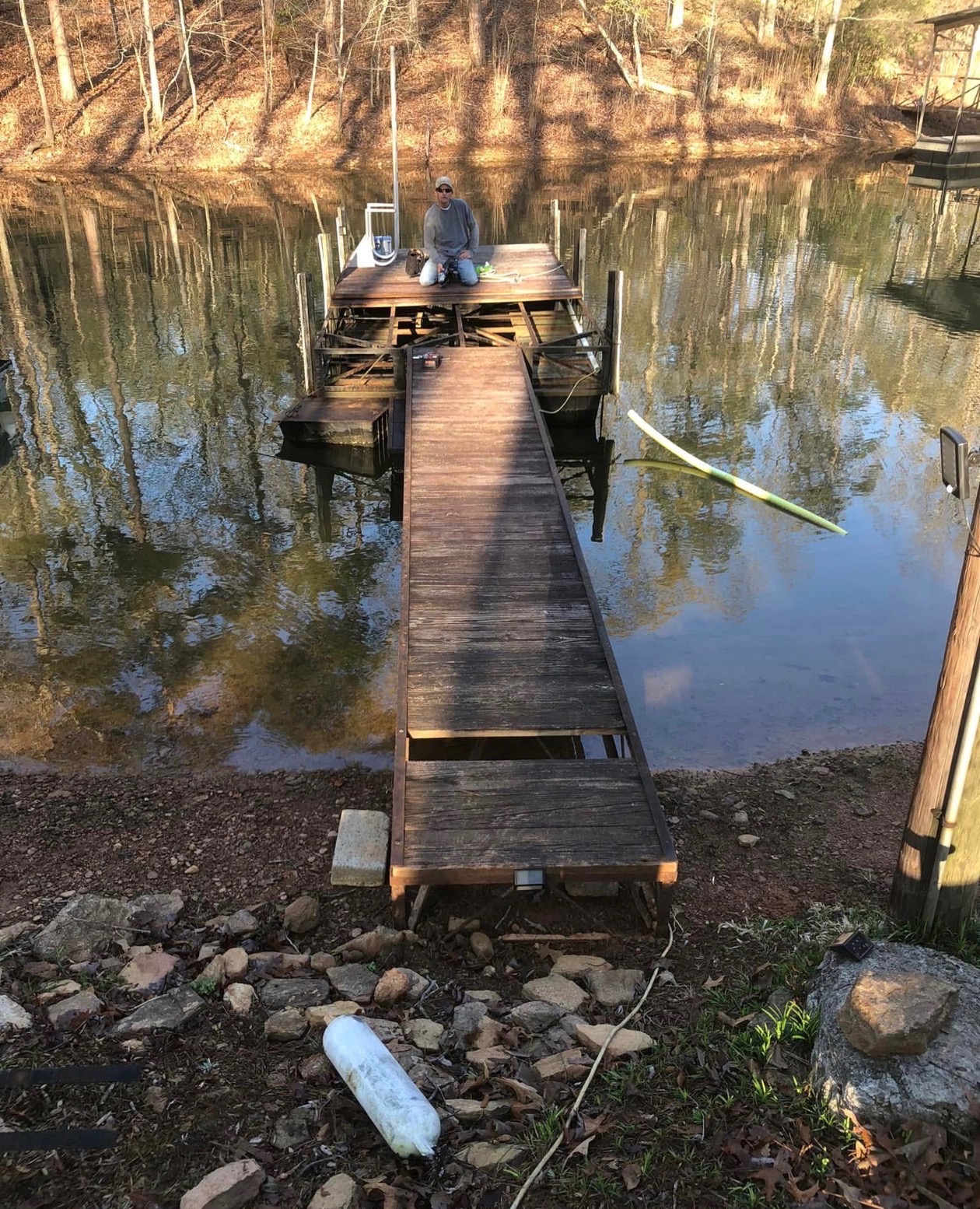 Dock decking removal and frame prep in progress by Limitless Construction Services