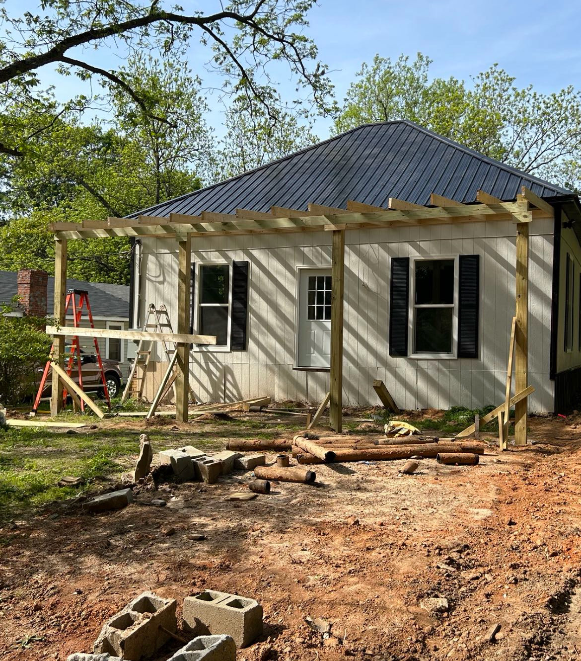 Framing and structural post installation in progress by Limitless Construction Services