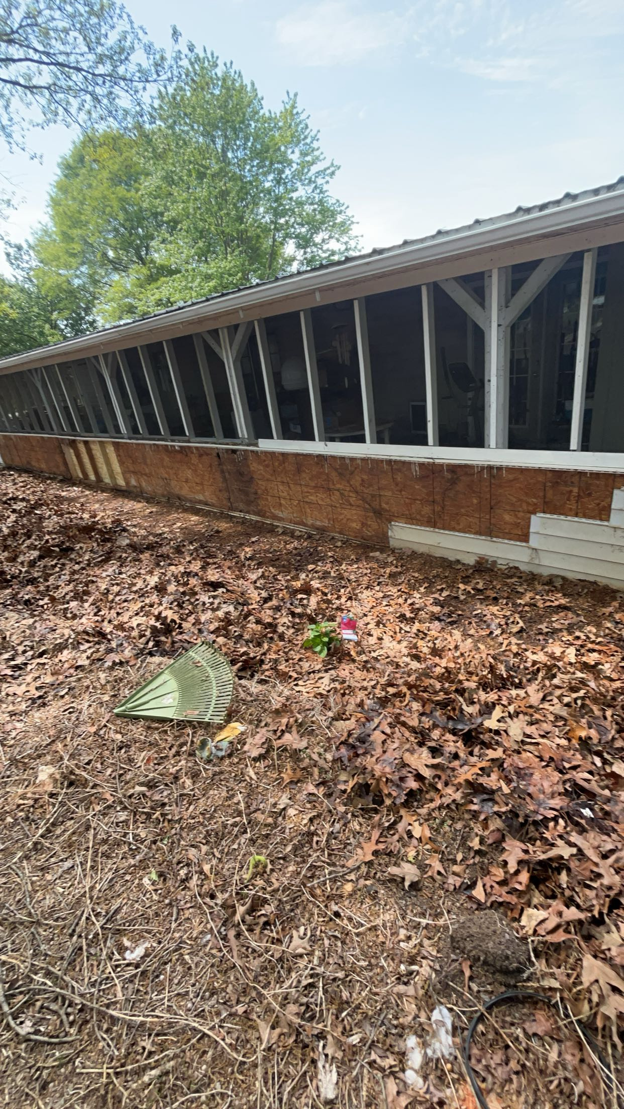 Screened porch lower wall prepared for new siding installation by Limitless Construction Services