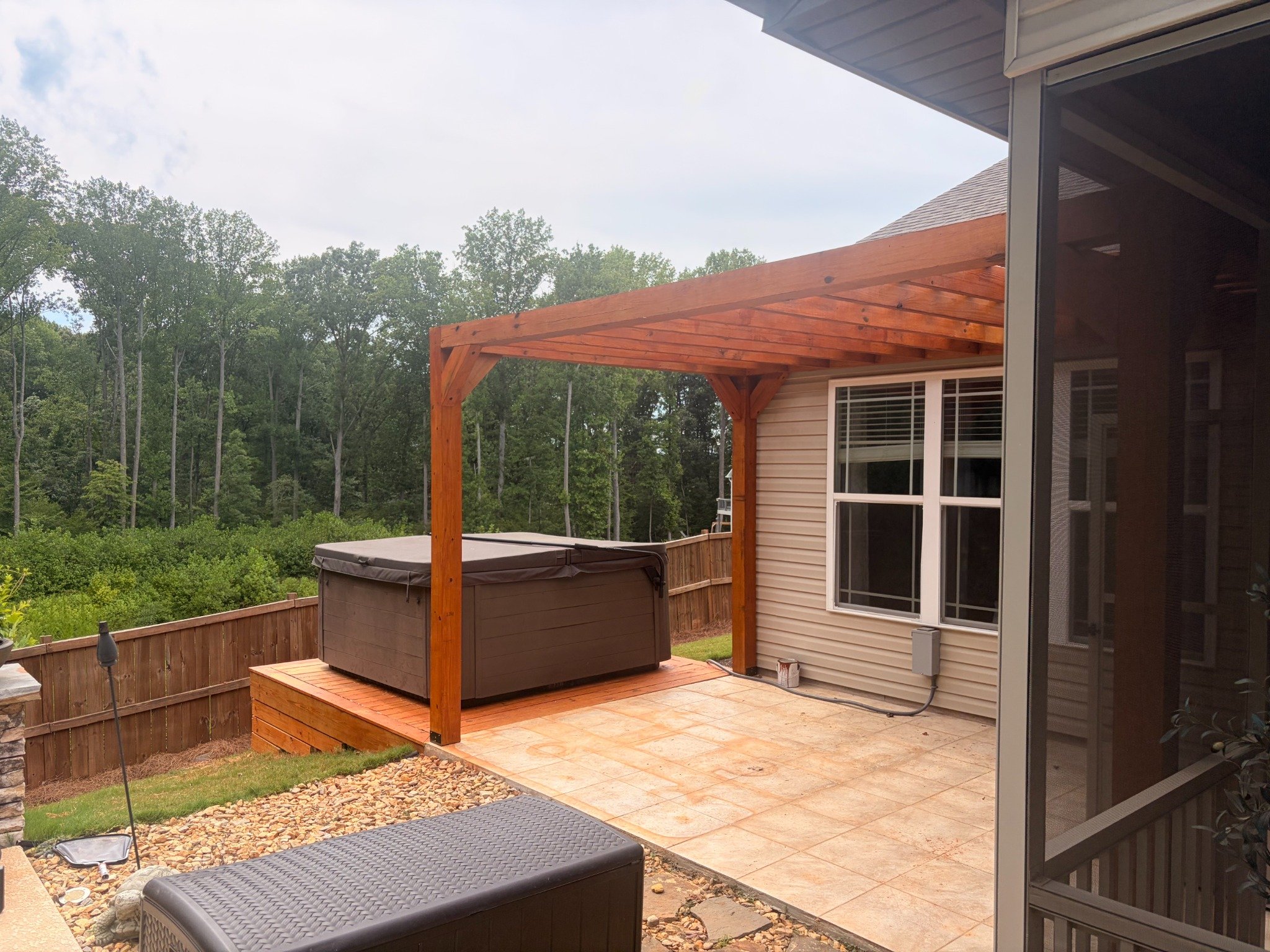 Side view of hot tub platform and pergola by Limitless Construction Services