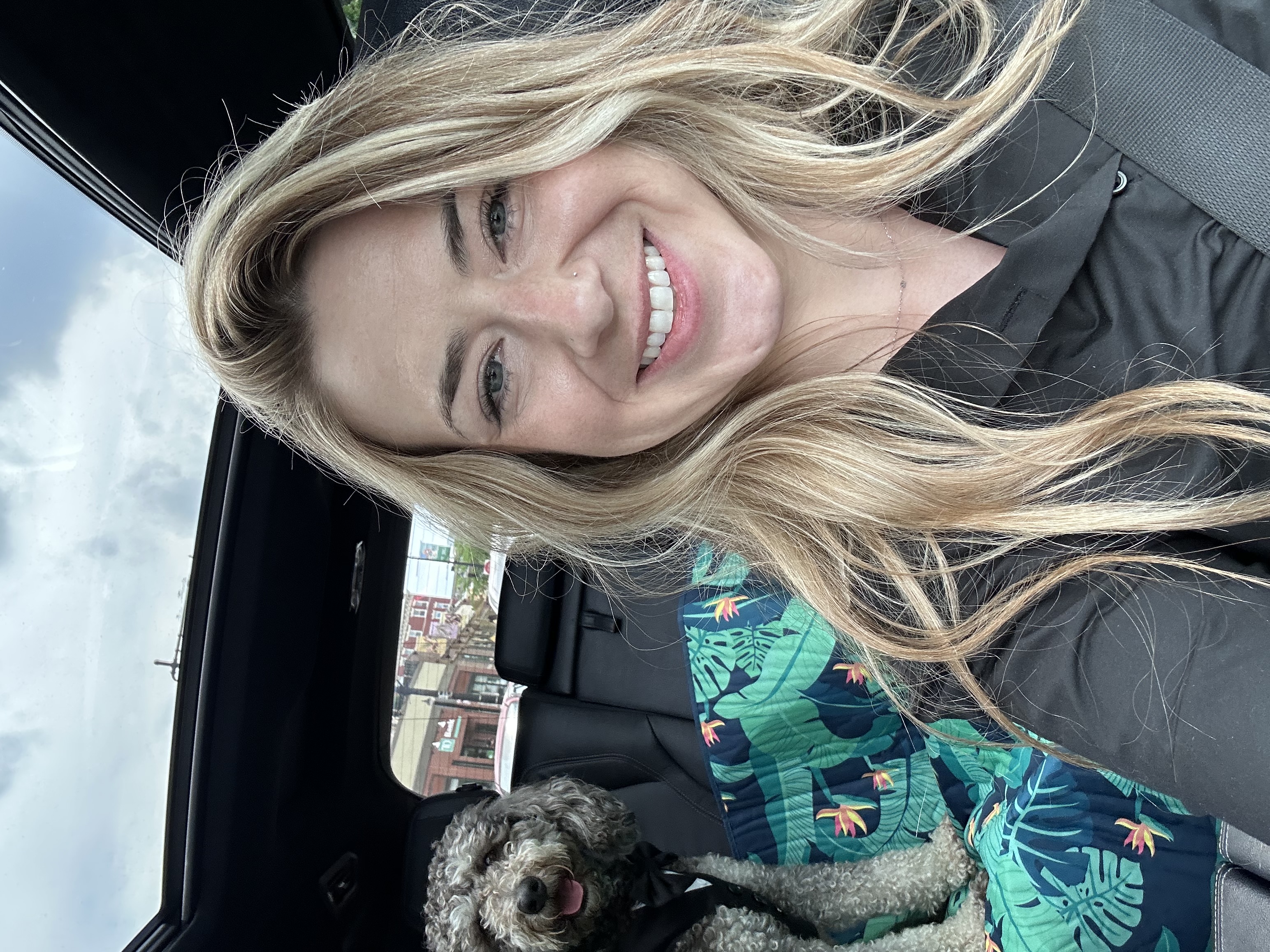 Alex in the car with a dog