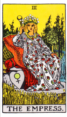 The Empress tarot card (Rider-Waite-Smith) seated crowned on an ornate red cushion surrounded by a golden wheat field, lush forest, and waterfall, holding a sceptre with the Venus symbol shield beside her