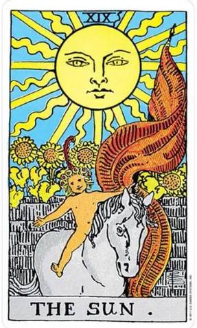 The Sun tarot card (Rider-Waite-Smith) showing a radiant sun with a face beaming down on a naked child crowned with flowers riding a white horse before a stone wall of blooming sunflowers