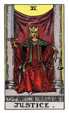 Justice tarot card (Rider-Waite-Smith) showing a crowned figure in red robes seated between stone pillars before a violet cloth of honour, holding an upright double-edged sword and scales of balance