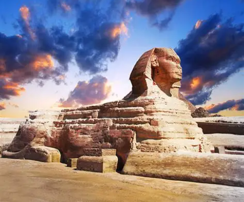The Great Sphinx of Giza beneath a dramatic sky at twilight