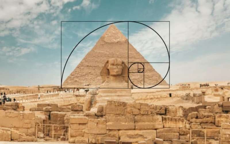 Golden ratio logarithmic spiral overlay diagram aligned with the Great Sphinx and the Pyramid of Giza in Egypt
