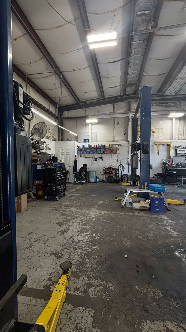 Interior view of AZ Auto Repair shop showing lifts and professional repair equipment
