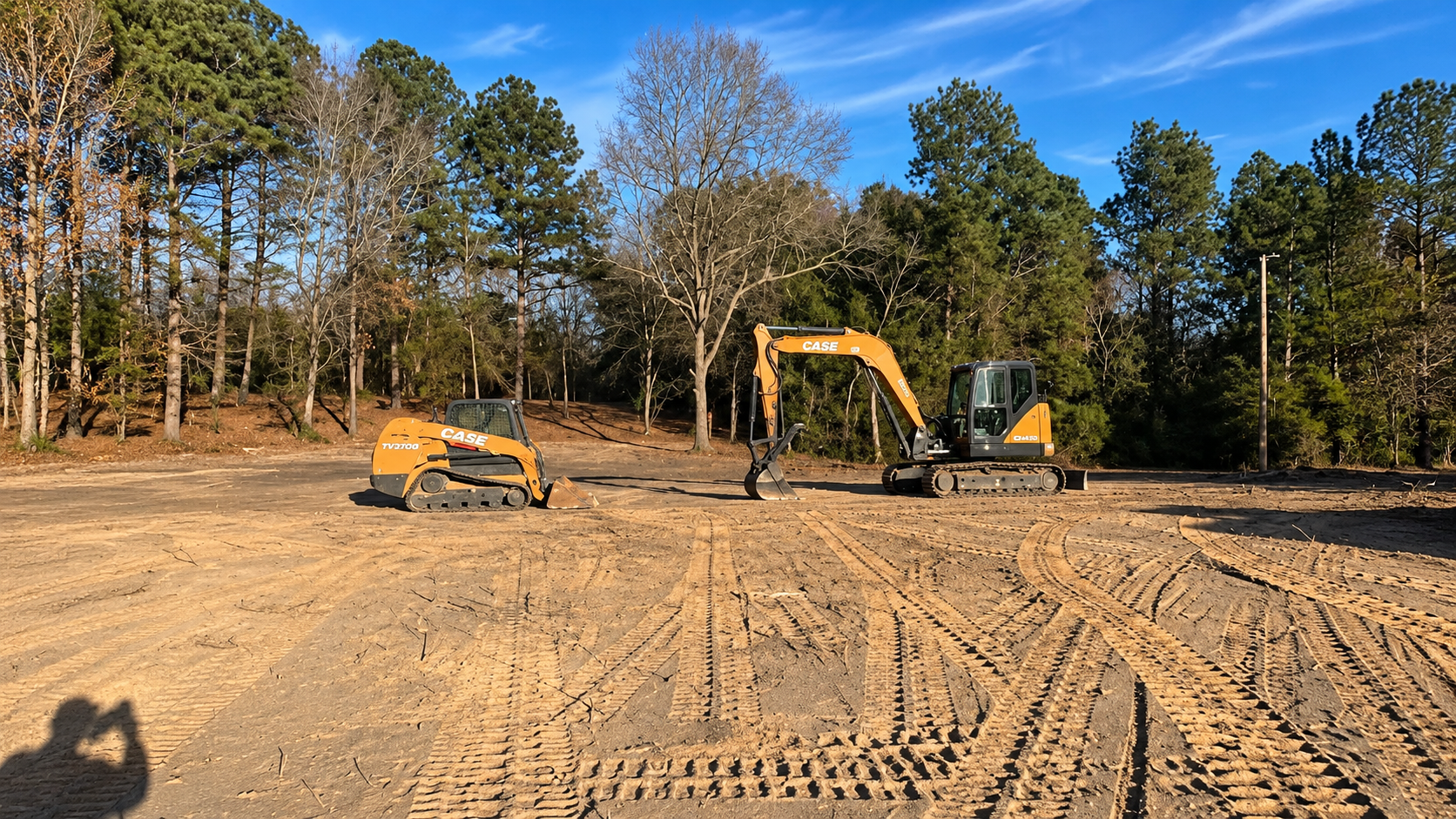 CASE excavator and track loader preparing broad building site with graded subgrade in Augusta, GA