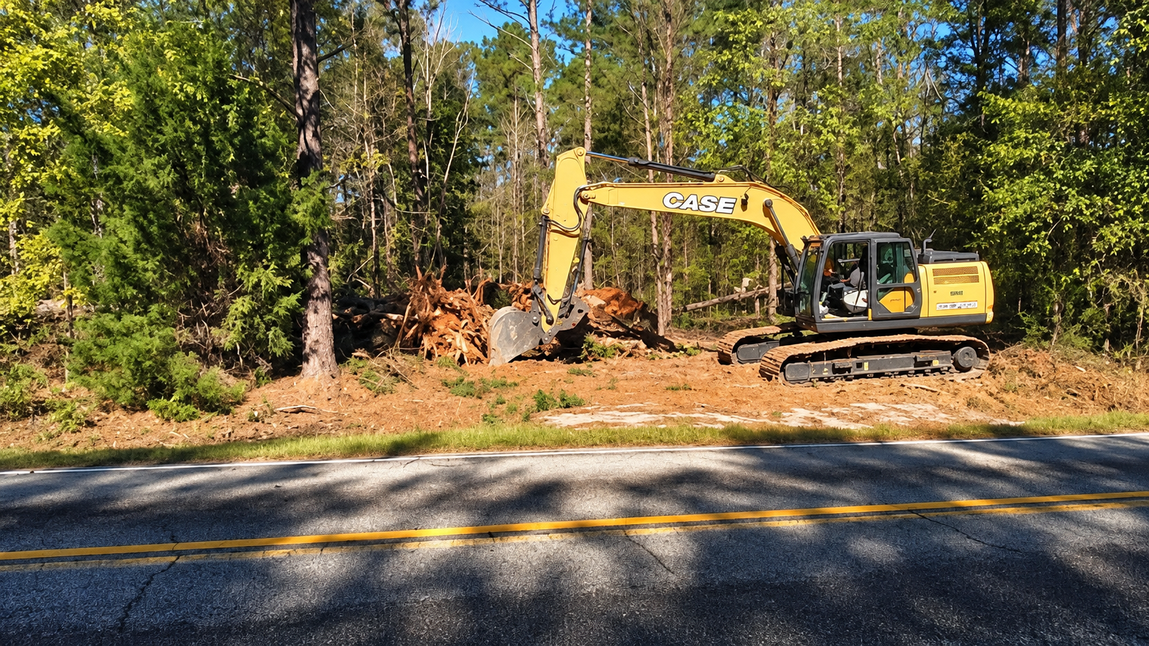CASE excavator performing land clearing and site prep in Augusta, GA