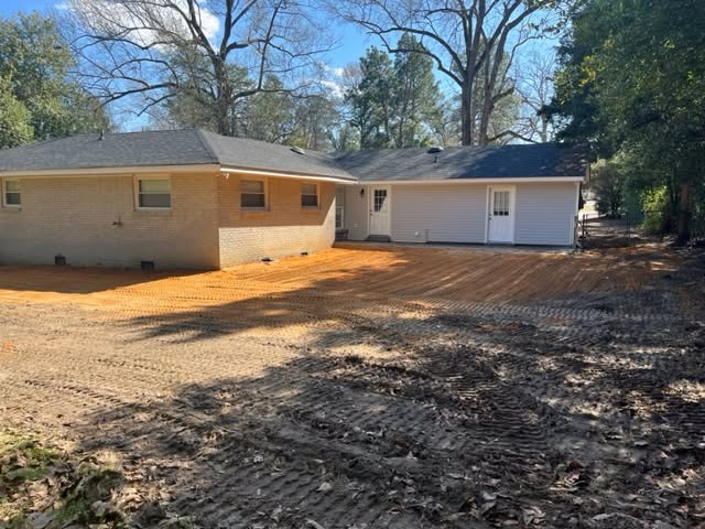 Breaking Ground finished leveling and residential grade preparation around house