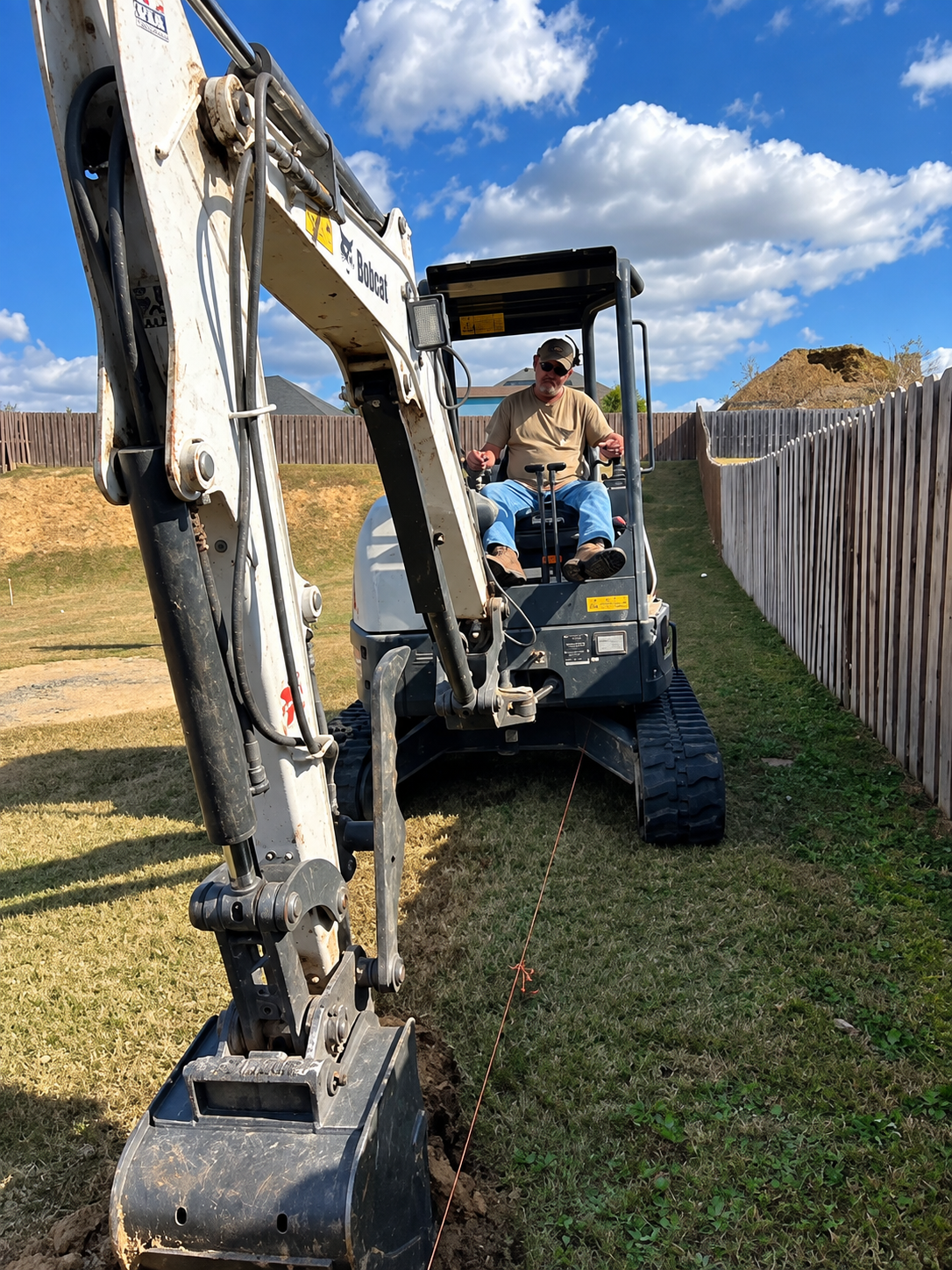 Breaking Ground Clearing & Grading operator and excavator working on site in Augusta, GA