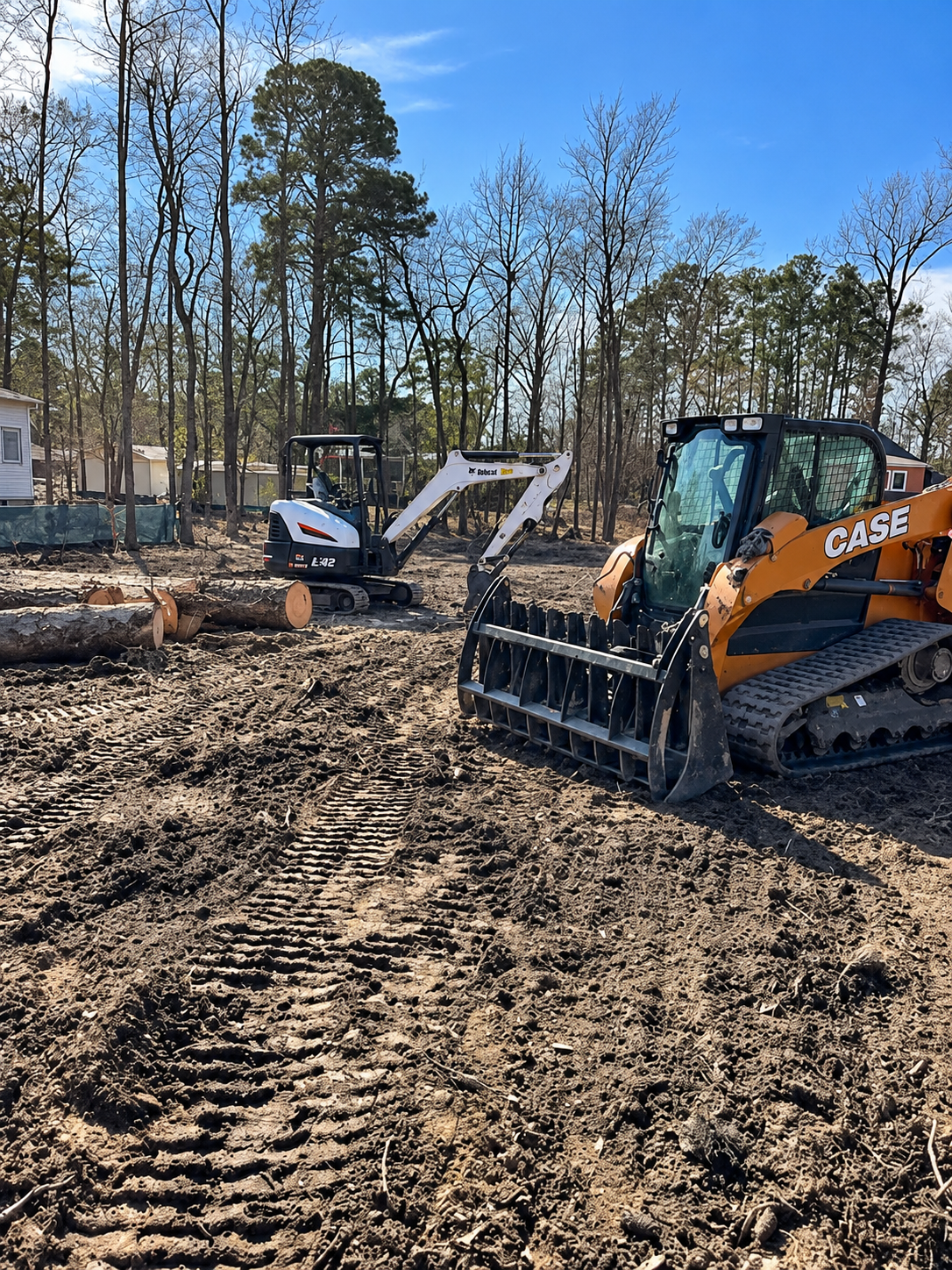 Breaking Ground equipment performing site preparation and grading on a cleared property