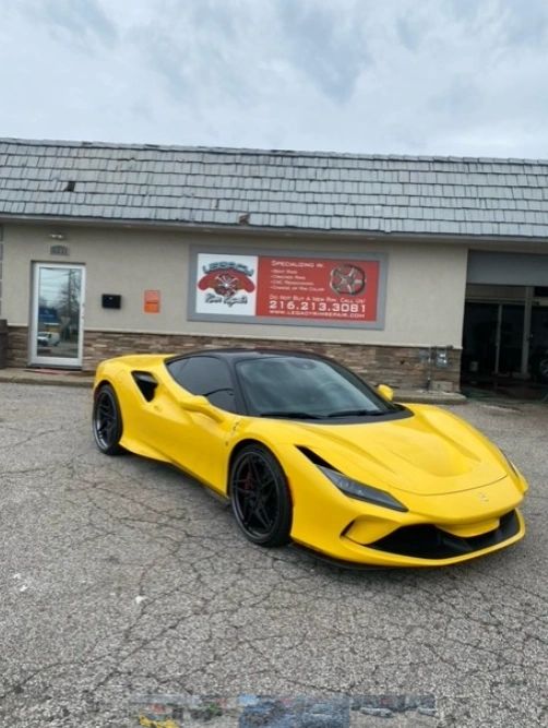 Cleveland Rim Repair shop with customer vehicles