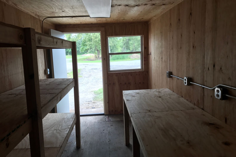 Container office interior with desktop and window