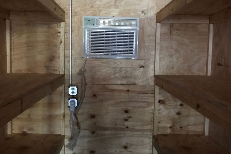 Plywood interior wall with air conditioning unit cut-out