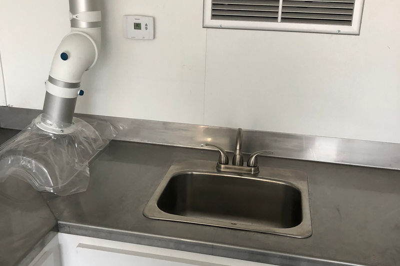 Stainless steel kitchenette sink in modified container