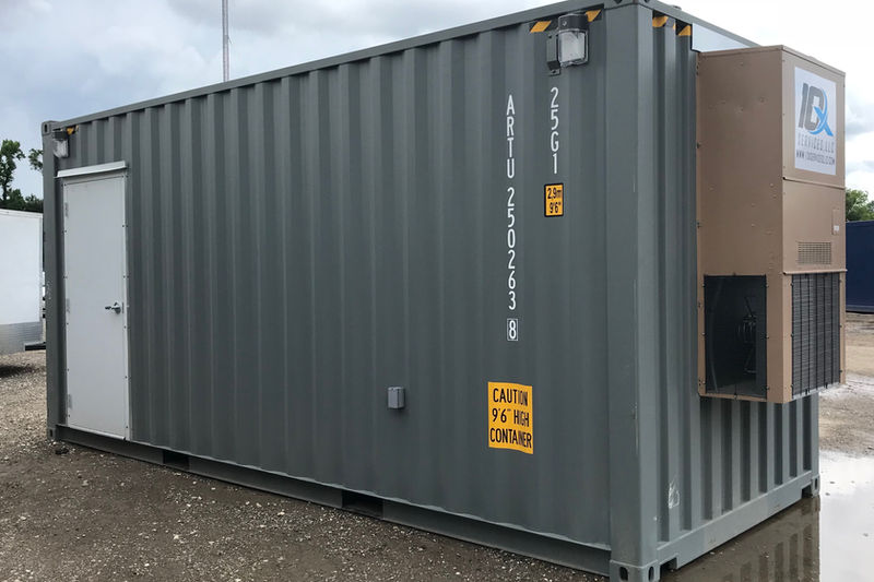 Modified grey storage container with custom HVAC and side entry