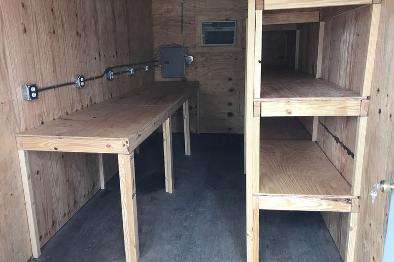 Jobsite office workbench, electrical wiring and shelving