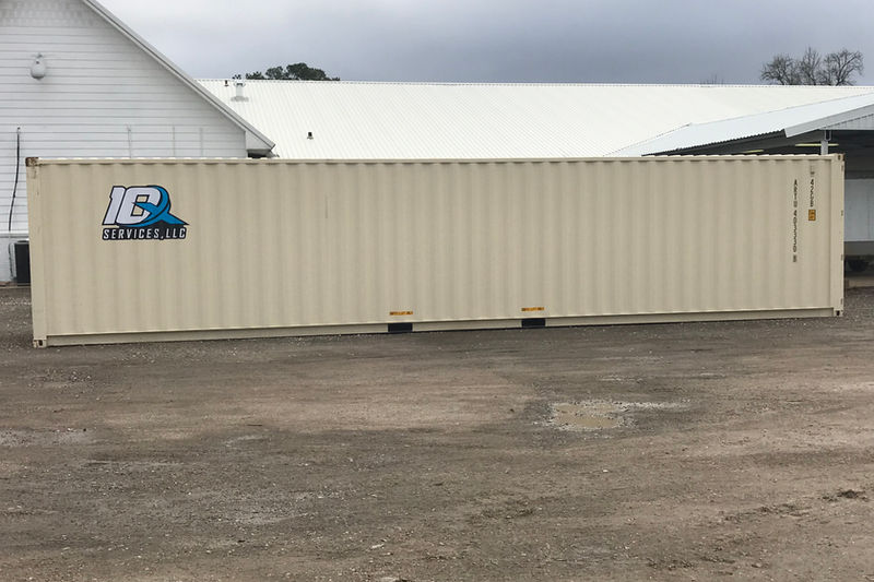 Beige storage container unit delivered on gravel lot