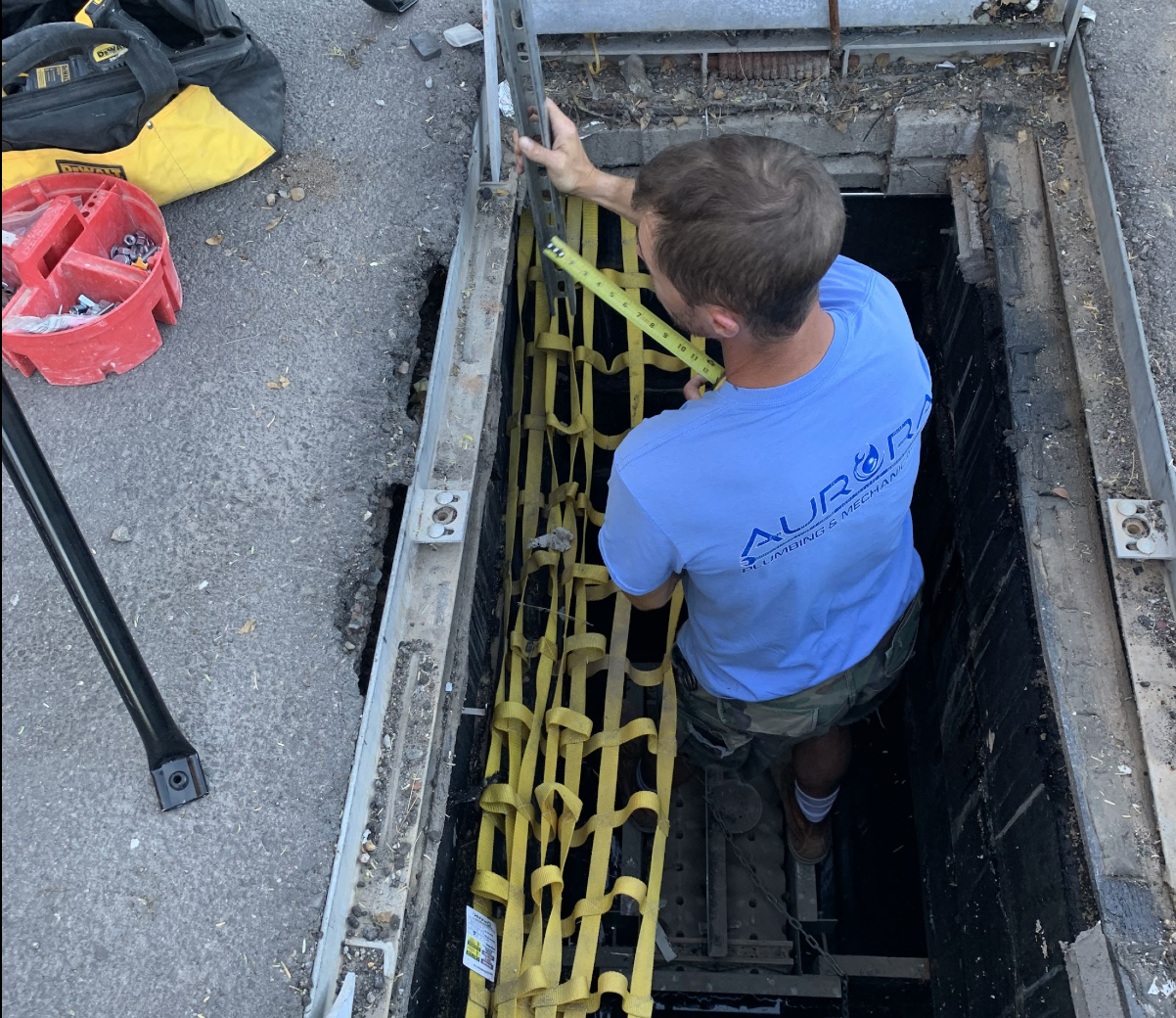 Dave Danberg of Aurora Plumbing working on a plumbing installation in Surprise, AZ