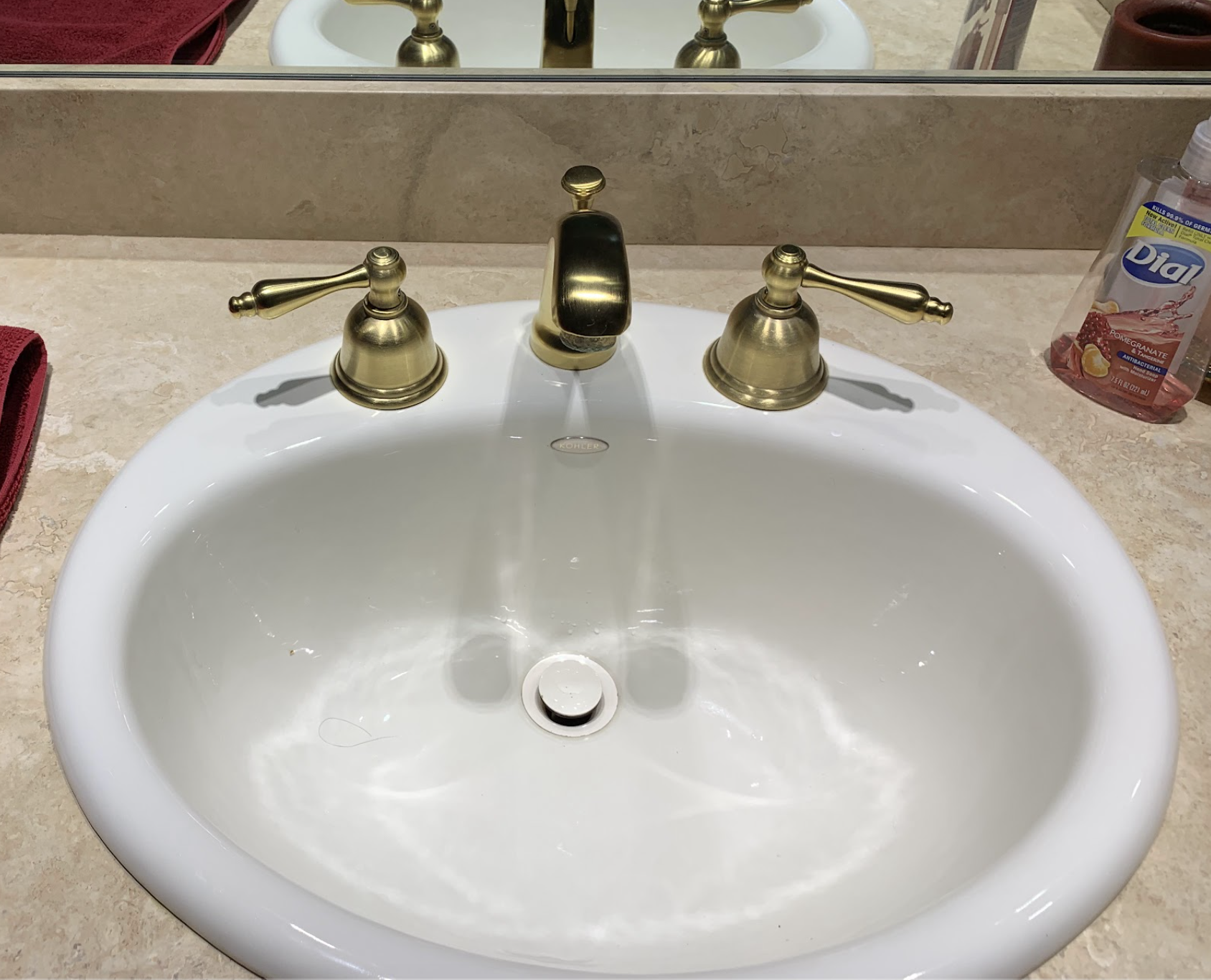 Bathroom sink and brass faucet installation by Aurora Plumbing in Cave Creek, AZ