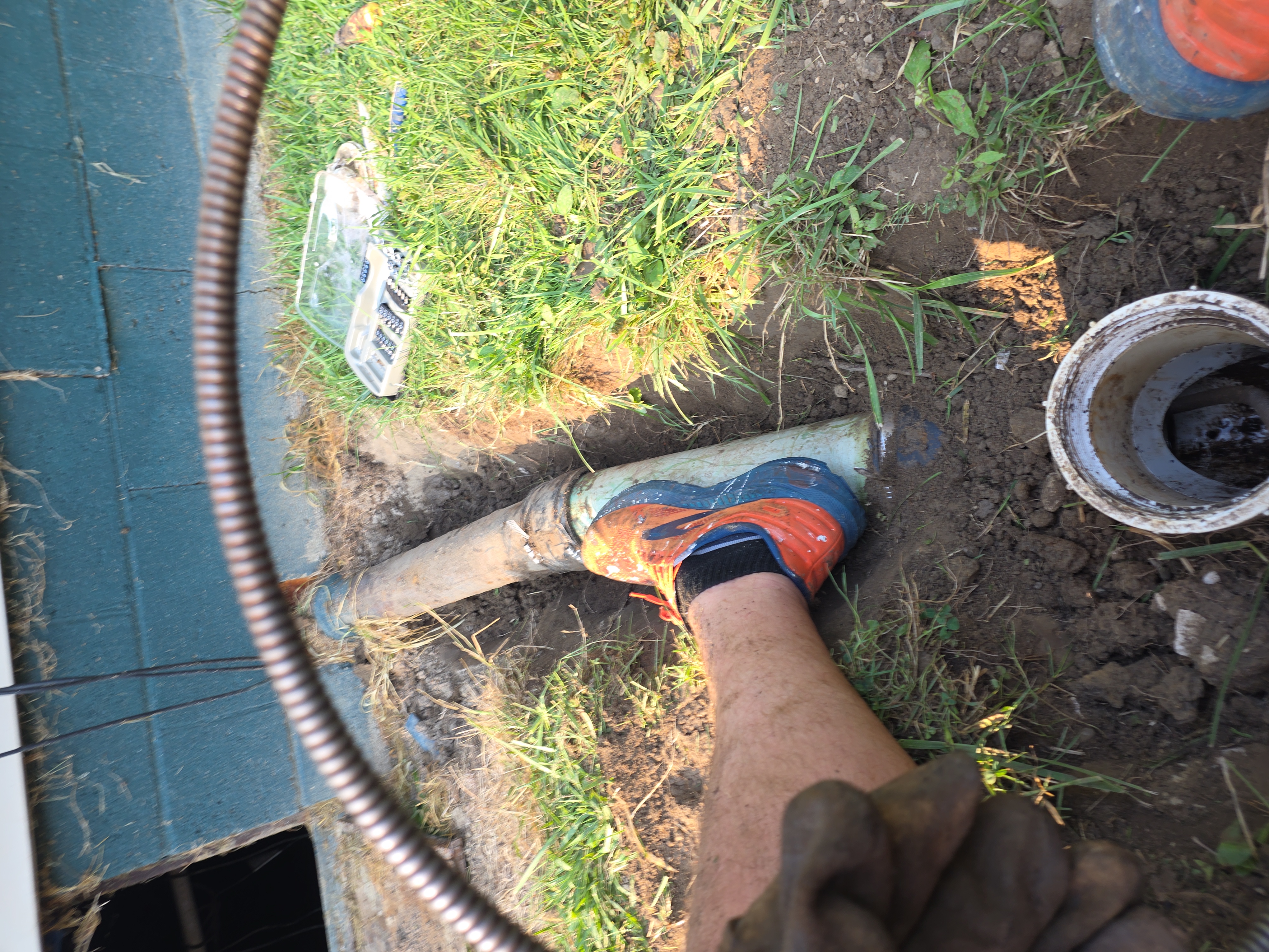 Underground trench pipe alignment during sewer line replacement