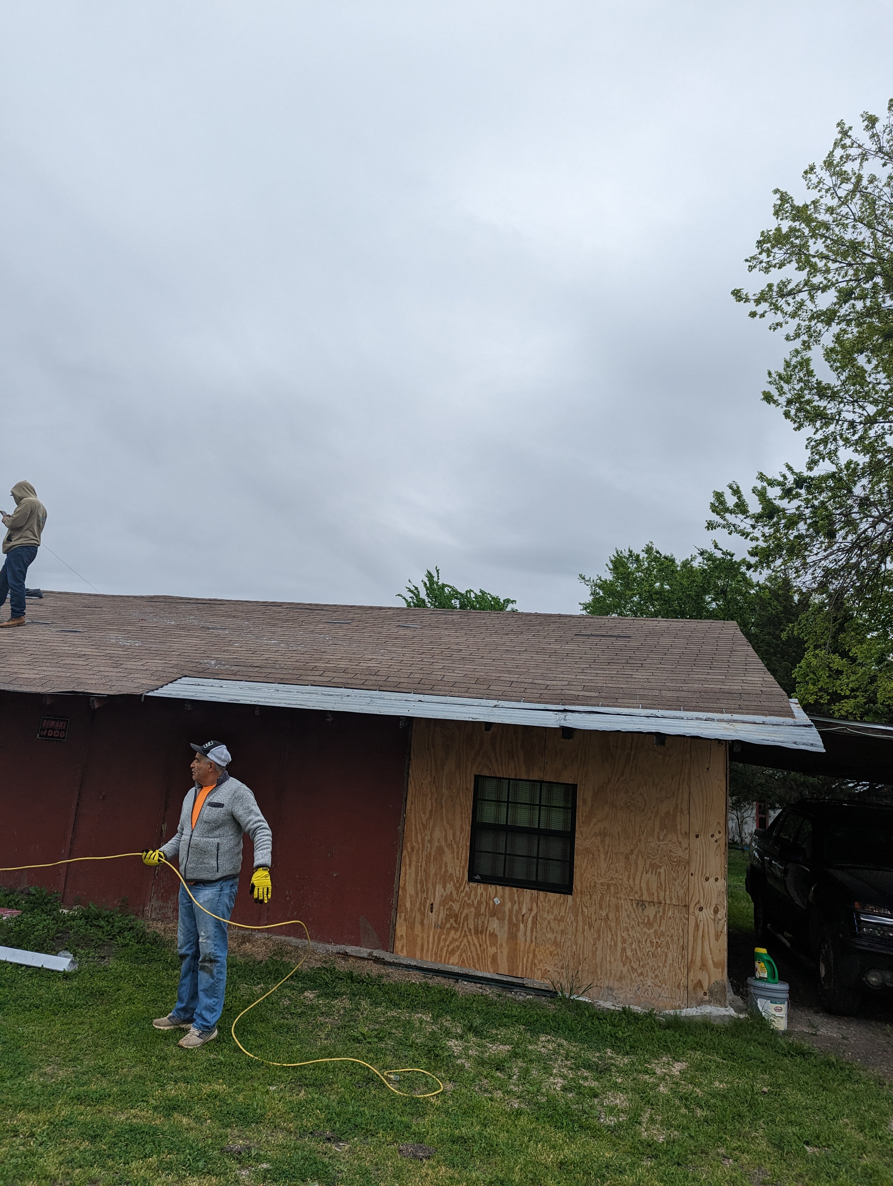 In-progress roof restoration and siding flashing repair in Dallas TX